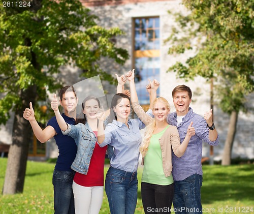 Image of group of smiling students showing thumbs up