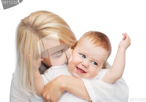 Image of happy mother kissing smiling baby