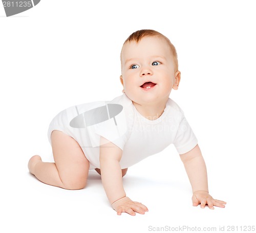 Image of crawling smiling baby looking up