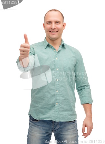 Image of smiling man showing thumbs up