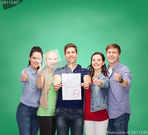 Image of group of students showing test and thumbs up