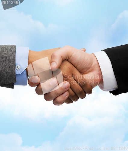 Image of businessman and businesswoman shaking hands