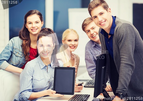 Image of students with monitor and blank tablet pc screen