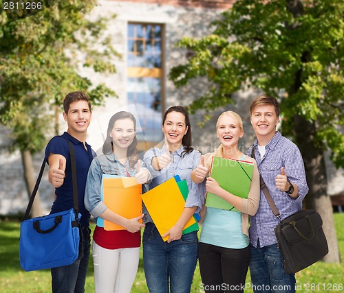 Image of group of smiling students showing thumbs up