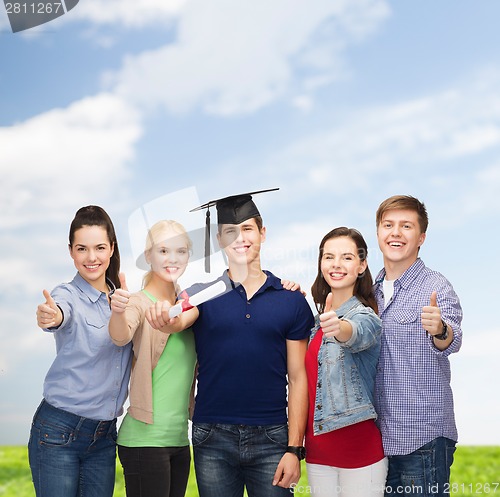 Image of group of students with diploma showing thumbs up