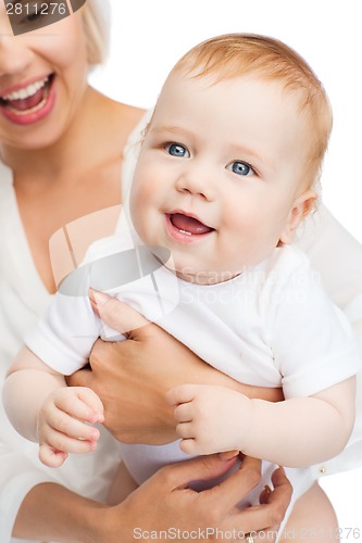 Image of close up of mother holding smiling baby