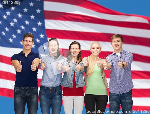 Image of group of smiling students showing thumbs up