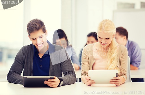 Image of students looking at tablet pc in lecture at school