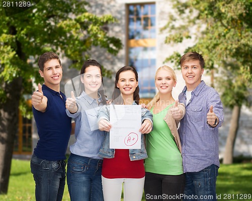 Image of group of students showing test and thumbs up