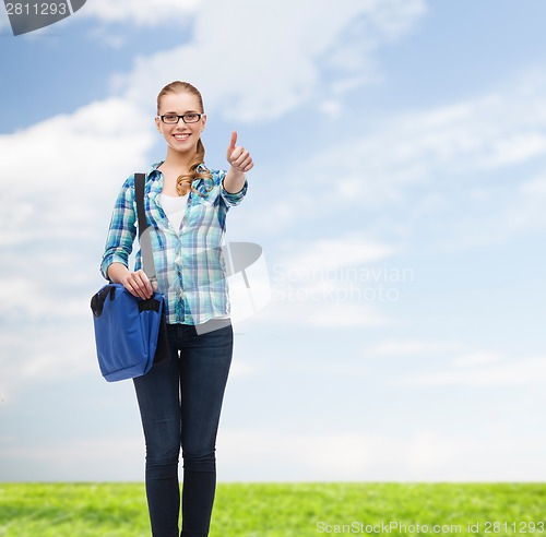 Image of student with laptop bag showing thumbs up