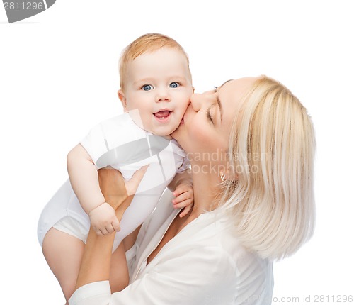 Image of happy mother kissing smiling baby