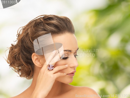 Image of woman with purple cocktail ring