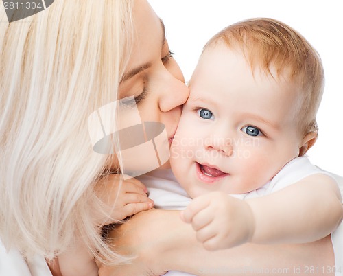 Image of happy mother kissing smiling baby