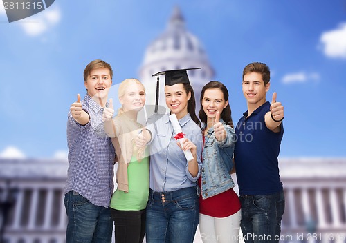 Image of group of students with diploma showing thumbs up