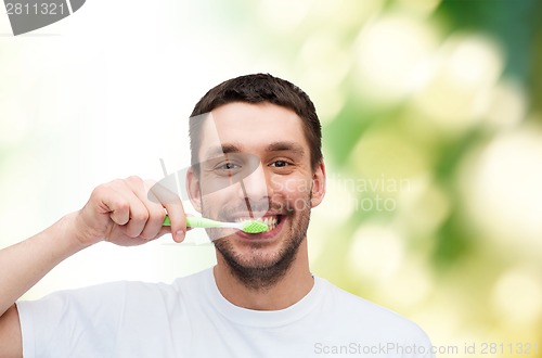 Image of smiling young man with toothbrush