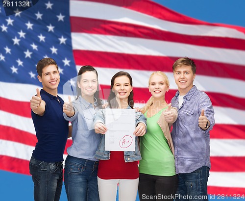 Image of group of students showing test and thumbs up