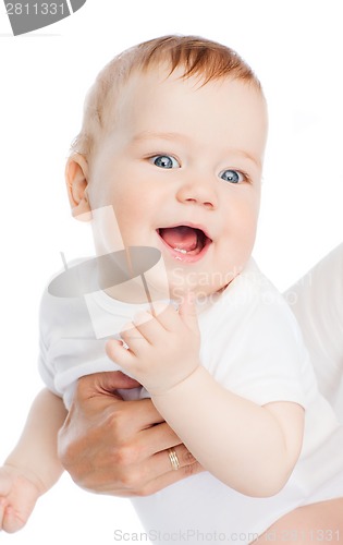 Image of close up of mother holding smiling baby