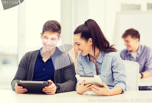 Image of students looking at tablet pc in lecture at school