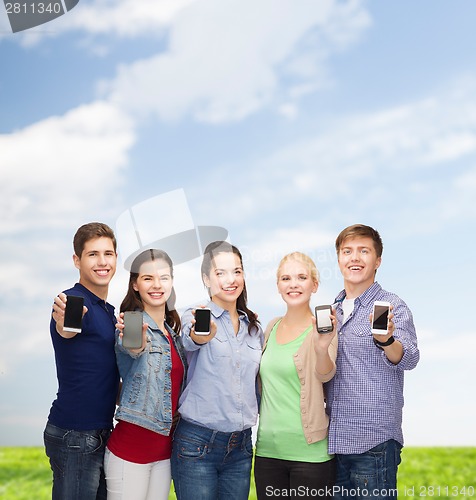 Image of students showing blank smartphones screens