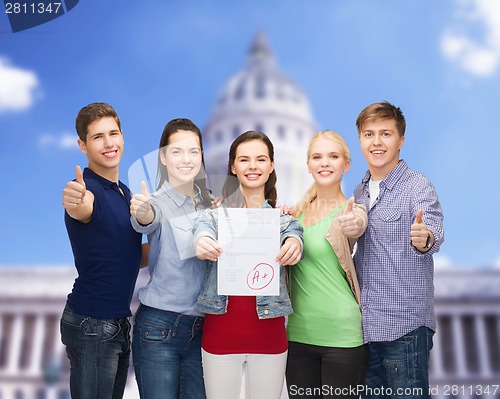 Image of group of students showing test and thumbs up