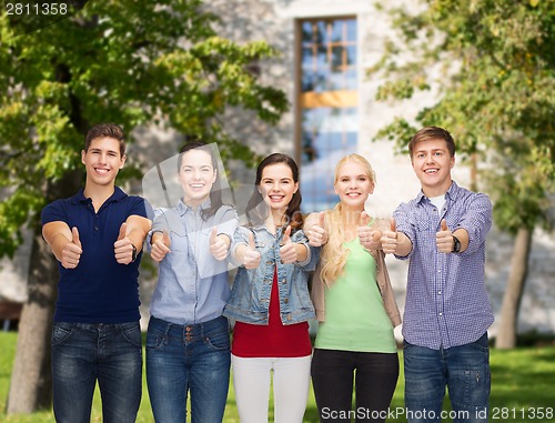 Image of group of smiling students showing thumbs up