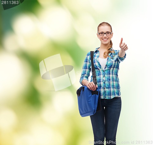 Image of student with laptop bag showing thumbs up