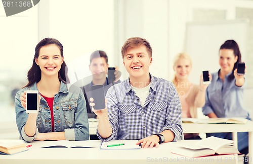 Image of students showing black blank smartphone screens
