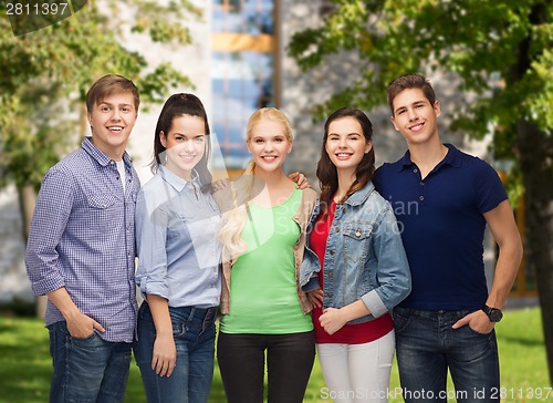 Image of group of standing smiling students
