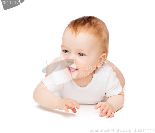 Image of smiling baby lying on floor