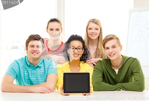 Image of smiling students showing tablet pc blank screen