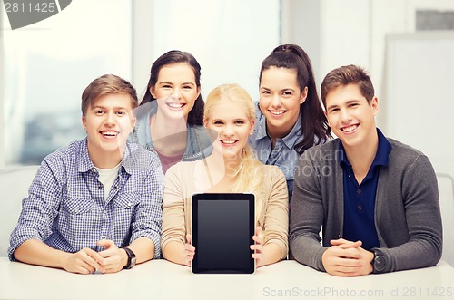 Image of smiling students with blank tablet pc screen