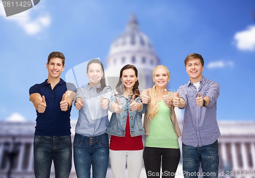 Image of group of smiling students showing thumbs up