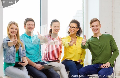 Image of smiling students with tablet pc computer