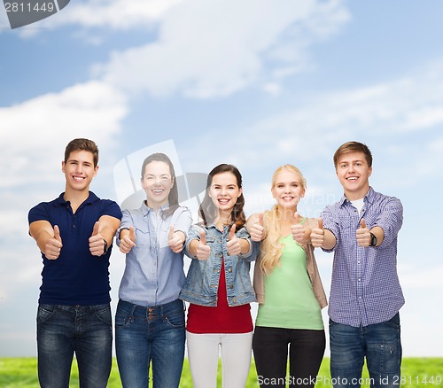 Image of group of smiling students showing thumbs up