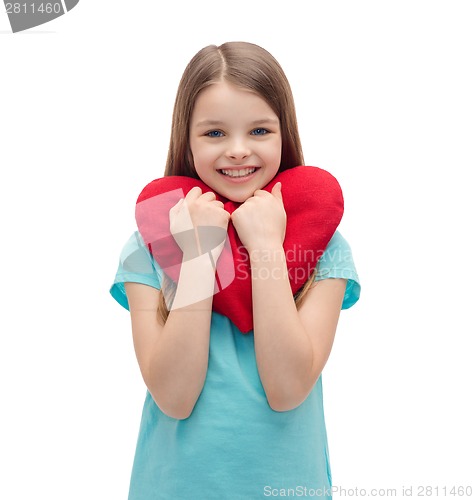 Image of smiling little girl with red heart