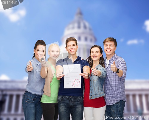 Image of group of students showing test and thumbs up