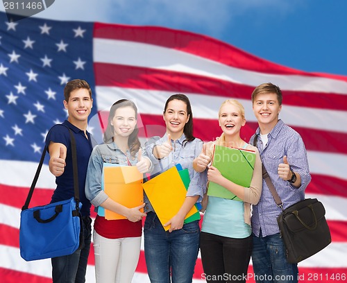 Image of group of smiling students showing thumbs up