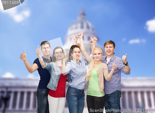 Image of group of smiling students showing thumbs up