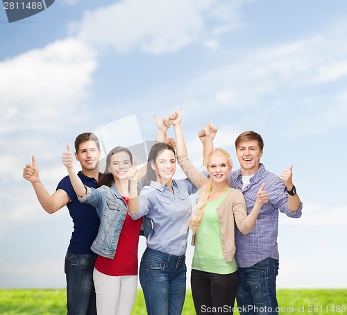 Image of group of smiling students showing thumbs up