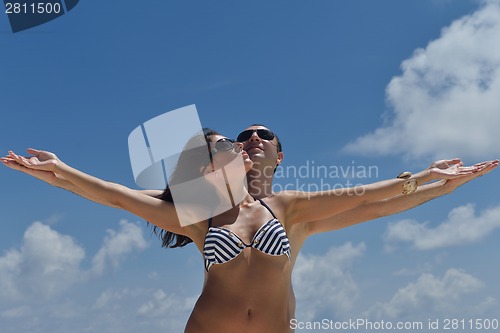 Image of happy young couple have fun on beach