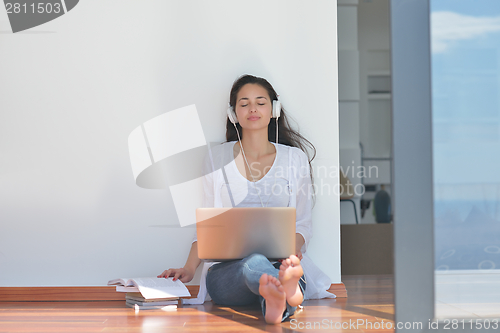 Image of relaxed young woman at home