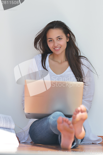 Image of relaxed young woman at home