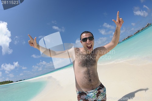 Image of beautiful young woman  on beach have fun and relax
