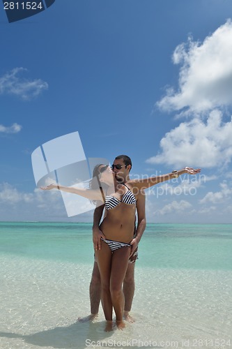 Image of happy young couple have fun on beach