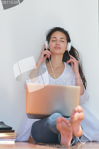 Image of relaxed young woman at home