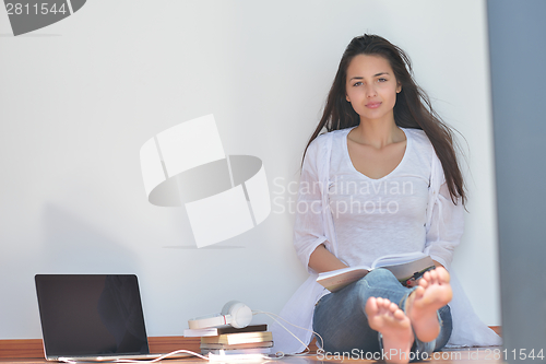 Image of relaxed young woman at home