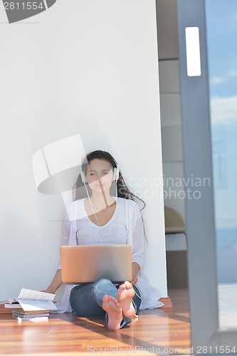 Image of relaxed young woman at home