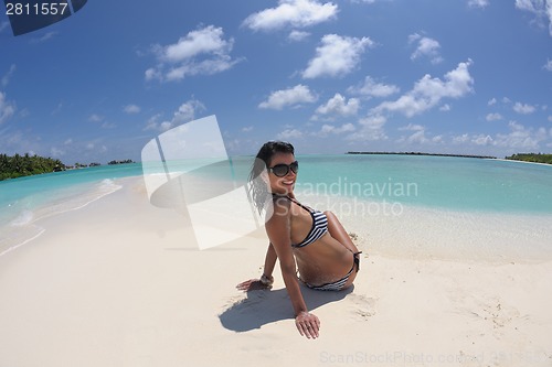 Image of beautiful young woman  on beach have fun and relax