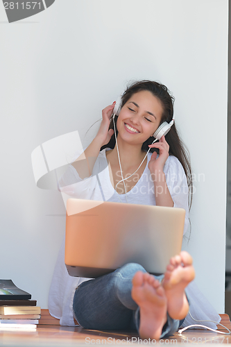 Image of relaxed young woman at home