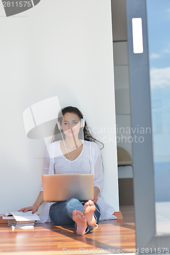 Image of relaxed young woman at home